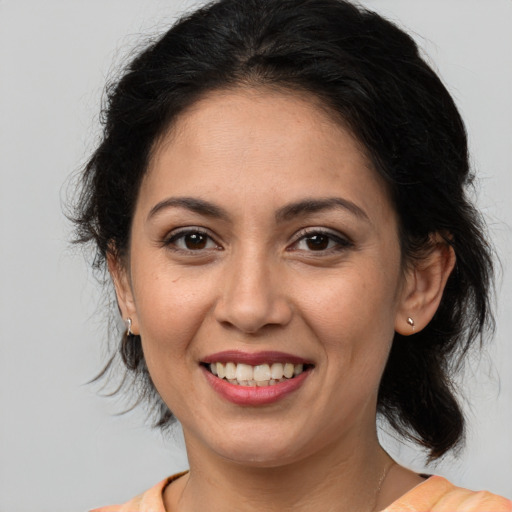 Joyful white young-adult female with medium  brown hair and brown eyes