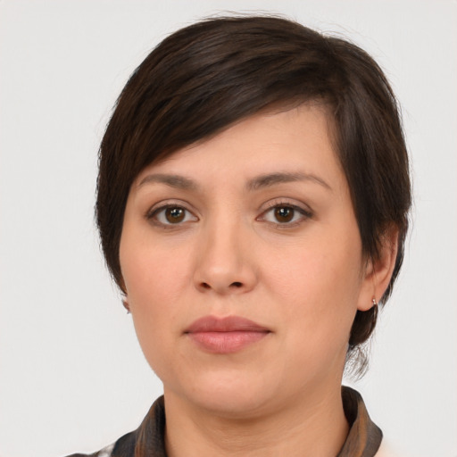 Neutral white young-adult female with medium  brown hair and brown eyes