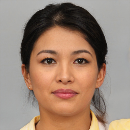 Joyful asian young-adult female with medium  brown hair and brown eyes