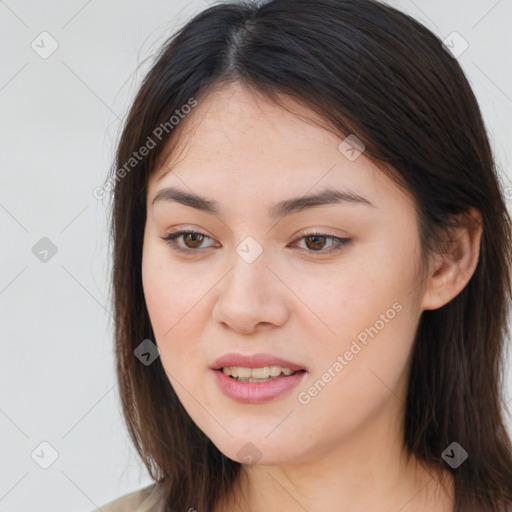 Joyful white young-adult female with long  brown hair and brown eyes