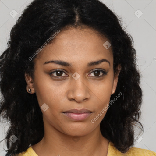 Joyful black young-adult female with long  brown hair and brown eyes