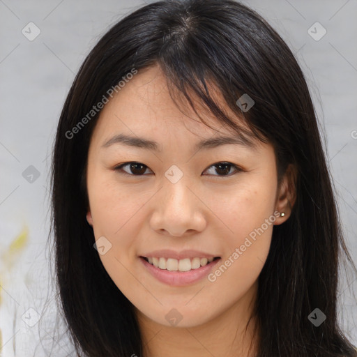 Joyful asian young-adult female with long  brown hair and brown eyes