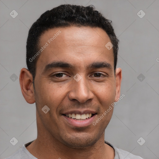 Joyful latino young-adult male with short  brown hair and brown eyes