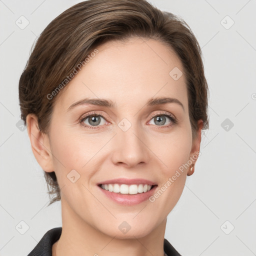 Joyful white young-adult female with medium  brown hair and grey eyes