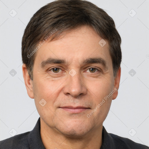 Joyful white adult male with short  brown hair and brown eyes