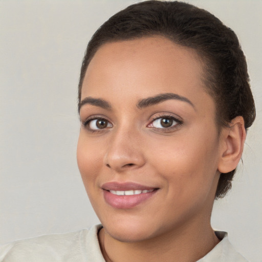 Joyful white young-adult female with short  brown hair and brown eyes