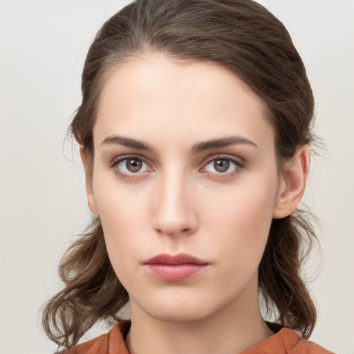 Neutral white young-adult female with medium  brown hair and brown eyes