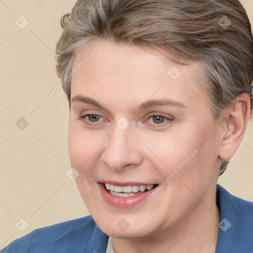 Joyful white adult female with short  brown hair and brown eyes