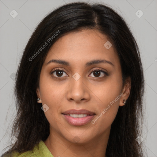 Joyful latino young-adult female with long  brown hair and brown eyes