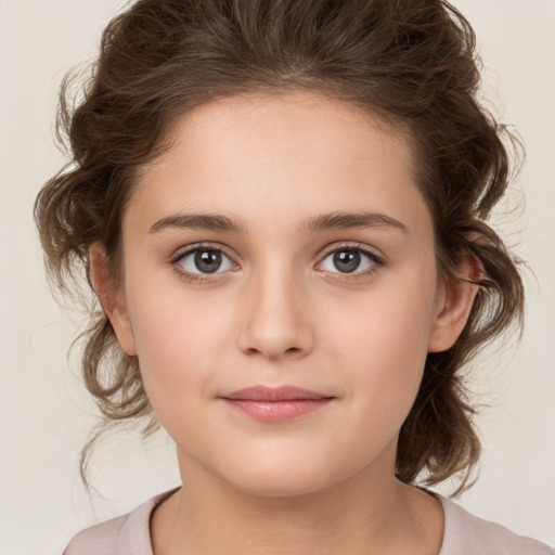 Joyful white child female with medium  brown hair and brown eyes