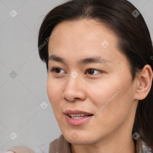 Joyful white young-adult female with medium  brown hair and brown eyes