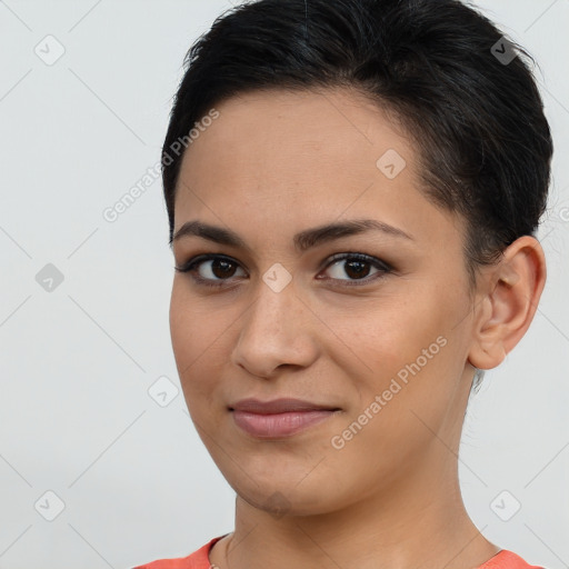 Joyful latino young-adult female with short  brown hair and brown eyes