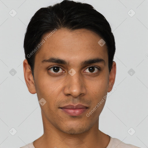 Joyful latino young-adult male with short  black hair and brown eyes