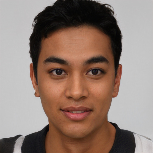 Joyful asian young-adult male with short  black hair and brown eyes