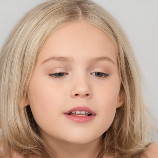 Joyful white child female with long  brown hair and brown eyes