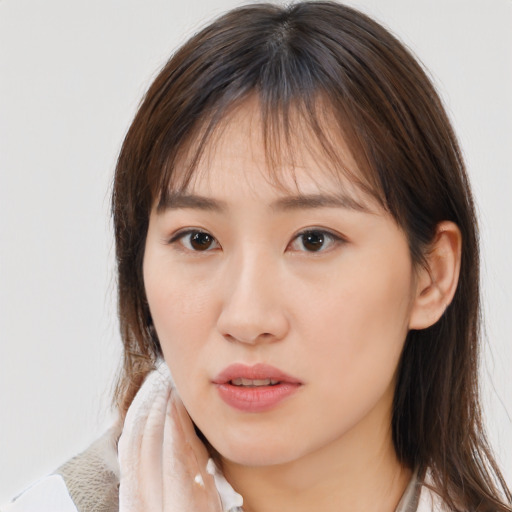 Neutral white young-adult female with medium  brown hair and brown eyes