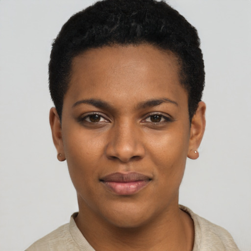 Joyful black young-adult female with short  black hair and brown eyes