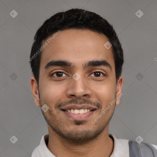 Joyful latino young-adult male with short  black hair and brown eyes