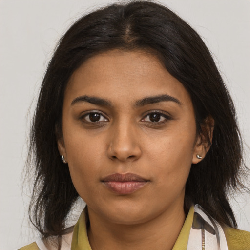 Neutral latino young-adult female with medium  brown hair and brown eyes