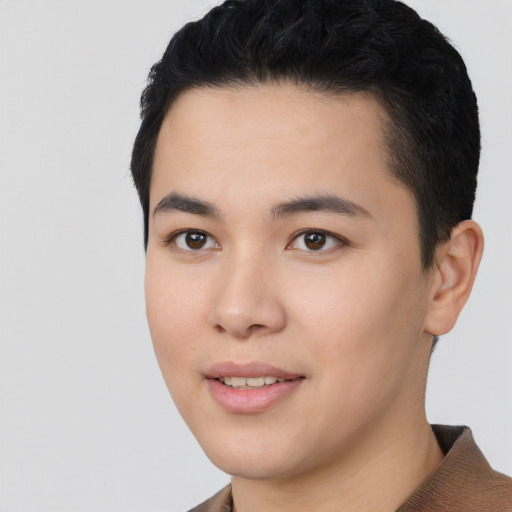 Joyful asian young-adult male with short  black hair and brown eyes