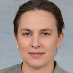 Joyful white adult female with short  brown hair and grey eyes