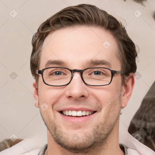 Joyful white young-adult male with short  brown hair and grey eyes