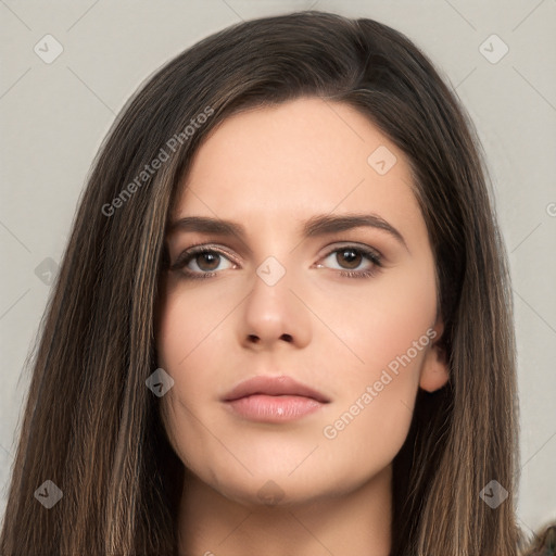 Neutral white young-adult female with long  brown hair and brown eyes