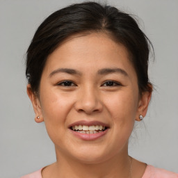 Joyful white young-adult female with medium  brown hair and brown eyes