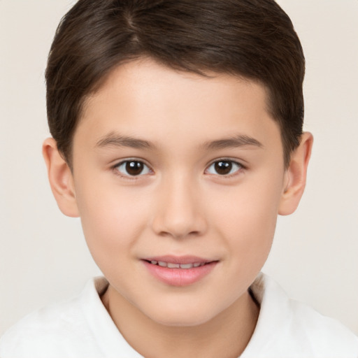 Joyful white child male with short  brown hair and brown eyes