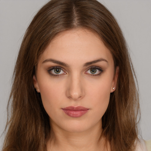 Neutral white young-adult female with long  brown hair and brown eyes