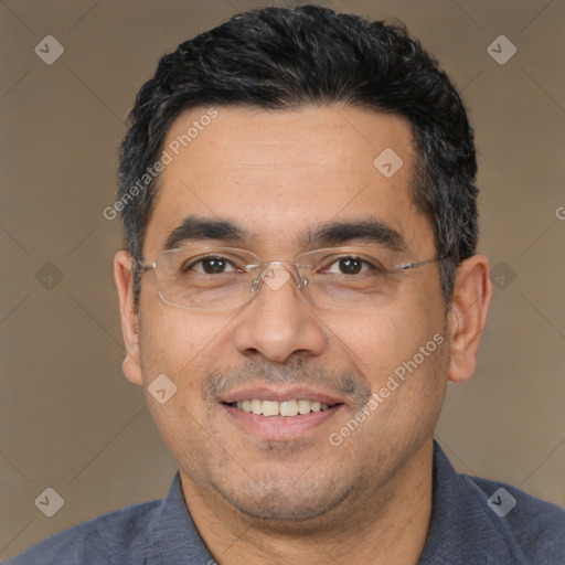 Joyful white adult male with short  black hair and brown eyes