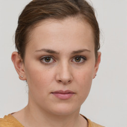 Neutral white young-adult female with short  brown hair and brown eyes