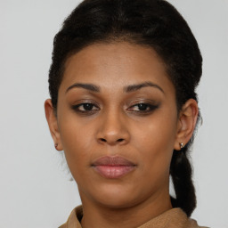 Joyful black young-adult female with short  brown hair and brown eyes