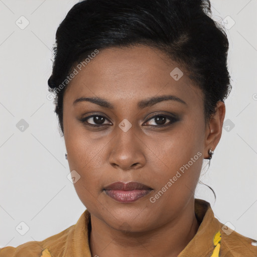 Joyful latino young-adult female with short  brown hair and brown eyes