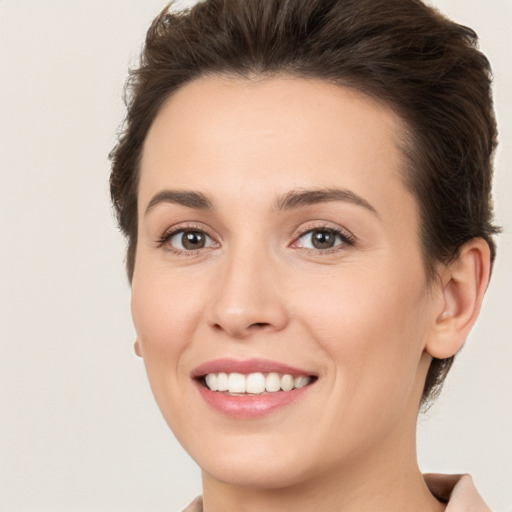 Joyful white young-adult female with medium  brown hair and brown eyes