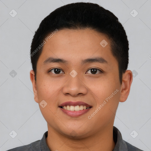 Joyful asian young-adult male with short  black hair and brown eyes