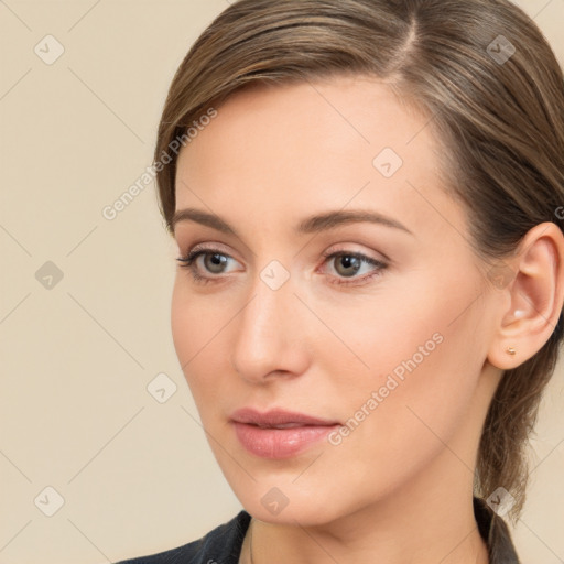 Neutral white young-adult female with long  brown hair and brown eyes