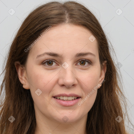 Joyful white adult female with long  brown hair and brown eyes