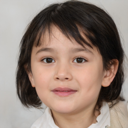 Joyful white child female with medium  brown hair and brown eyes
