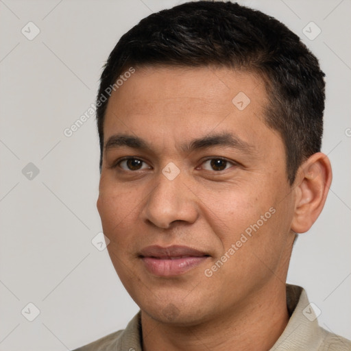 Joyful white young-adult male with short  black hair and brown eyes