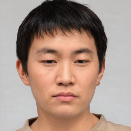 Neutral asian young-adult male with short  brown hair and brown eyes