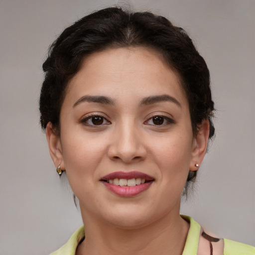 Joyful latino young-adult female with short  brown hair and brown eyes