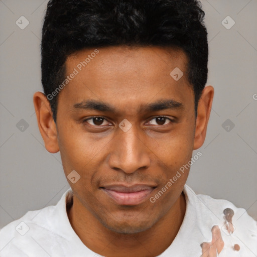 Joyful latino young-adult male with short  brown hair and brown eyes