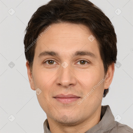 Joyful white adult male with short  brown hair and brown eyes