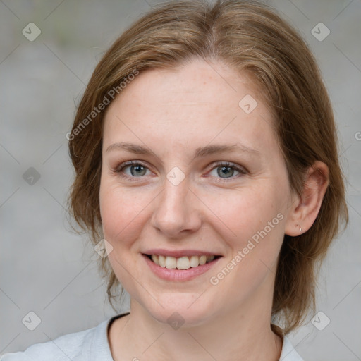 Joyful white young-adult female with medium  brown hair and blue eyes