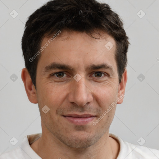 Joyful white adult male with short  brown hair and brown eyes