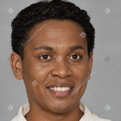 Joyful black young-adult male with short  brown hair and brown eyes