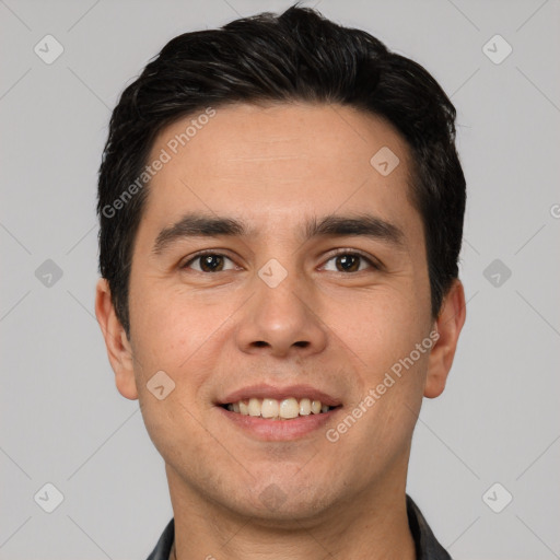 Joyful white young-adult male with short  black hair and brown eyes