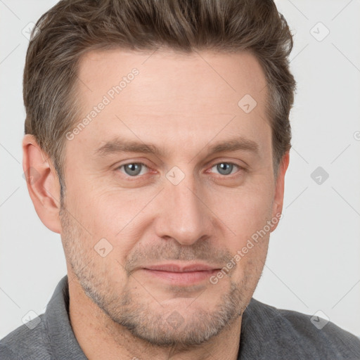 Joyful white adult male with short  brown hair and grey eyes