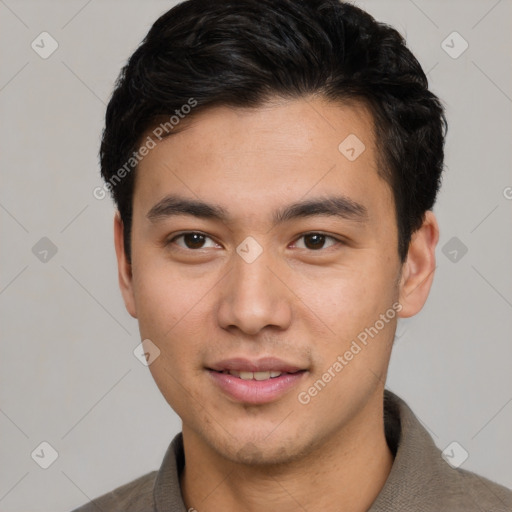 Joyful asian young-adult male with short  brown hair and brown eyes